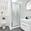 The classic white tiles add a touch of simplicity and elegance. 3