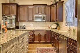 Read more cabinet refinishing keeping your existing cabinets, doors and drawer fronts and applying a new factory finish with unlimited color choices. Our Delaware Peppercorn Cabinets Shown With Black Glaze From The Value Series Are Paired Here W Custom Kitchen Cabinets Kitchen Cabinets Personalized Kitchen