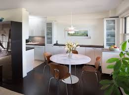 Modern Dark Wood Floors And Light Walls Provide A Clean Backdrop For Pops Of Greens And Blues Thro Dining Chair Design Luxury Dining Tables Dining Table Chairs