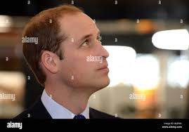 The Duke of Cambridge watches poet Stephen Morrison-Burke reciting a poem  during a visit to Birmingham Library, in Birmingham Stock Photo