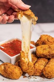 Add the marinara sauce to a bowl and place on a plate, then decorate the fried mozzarella patties around the. Best Keto Mozzarella Cheese Sticks Recipe Cheesy And Gooey