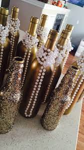 Throw a party full of jazz bands, bootleggers, flappers & other friends. Roaring 20s Centerpieces Diy Daniellesdiyfun Goldwinebottles Glitter Modpodg Roaring 20s Party Decorations Gatsby Party Decorations 20s Party Decorations