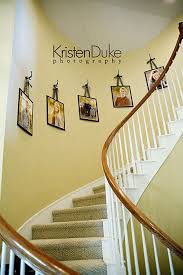 The wall beside the stairs is a blank canvas that you can use to display your favorite decorative items. Great For Amanda A Wall By Stairs Love The Ribbon Hanging Stairway Decorating Staircase Decor Curved Walls