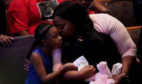 A man raised his fist at an event commemorating the anniversary of george floyd's death at the salvation army harbor lights center on may 25, 2021 in minneapolis. George Floyd Children How Many Children Did George Floyd Have World News Express Co Uk