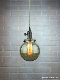 Here is a collection of industrial pendants designs that define the style. Glass Globe Edison Pendant Industrial Lighting Hanging Lamp Smoked Glass Glass Globe Pendant Light Low Ceiling Lighting Glass Globe Pendant