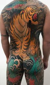 These powerful creatures are solitary hunters and are usually depicted with teeth bared in aggressive postures often surrounded by bamboo. Japanese Tiger Tattoos Meanings Tattoo Ideas More