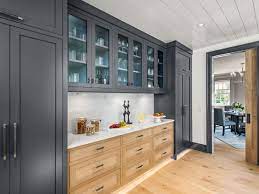 Currently, hot water pipe for baseboard heating loop runs in front of the cabinets, in the toe kickspace. Cabinets This Old House