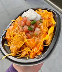 Nonfat milk, cheese whey, water, vegetable oil (canola oil, soybean oil), modified food starch, maltodextrin, natural flavors, salt, dipotassium phosphate, jalapeno puree, vinegar, lactic acid, cellulose gum, potassium citrate, sodium stearoyl. Taco Bell Will Debut New Buffalo Chicken Nacho Fries