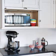 A Cramped Kitchen Opens Up To Make Room For The Whole Family Kitchen Hidden Microwave Kitchen Inspirations