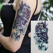 23 half sleeve tattoos for women. Black Ink Pirate Skull With Flowers Tattoo On Women Left Half Sleeve