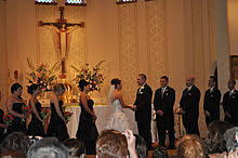 They can be found surrounding the altar at mass, or in front of statues and other prominent works of art. Wedding Wikipedia