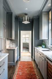gray galley style pantry with orange