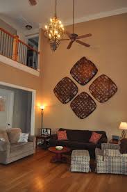 Tobacco Basket Idea Great Solution For That Soaring Wall In The Room With The Cathed Basket Wall Decor Cathedral Ceiling Living Room Wall Decor Living Room
