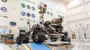 Highlighted parts in gold, black and silver, nasa logo at front. Nasa Mars Rover Key Questions About Perseverance Bbc News
