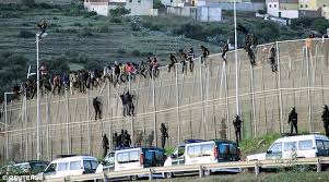 The border had to be closed several times on tuesday as o. Migrants Hiding In Car Speed Through Moroccan Border Daily Mail Online
