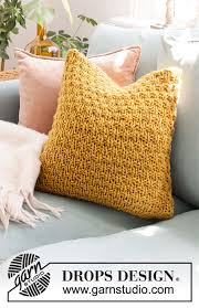 Webs has a wide range of free knitting patterns available, including a multitude of blanket, garment, and accessory projects. Tea And Honey Pillow Drops 207 46 Free Knitting Patterns By Drops Design