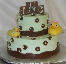 Baby showers are colorful, fun, energetic and filled with laughter as family and friends get together to celebrate a new impending birth. Mint Green And Brown Two Tier Baby Shower Cake With Fondant Rubber Ducks Arteatsbakery