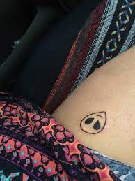 Black and gray middle back tattoo Alien Head Tattoo