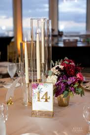 Wedding Reception Table Centerpiece Is A Lush Bridesmaids Bouquet Of J Wedding Reception Tables Centerpieces Candle Wedding Centerpieces Gold Wedding Reception