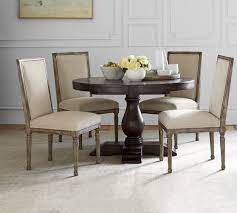 Design a beautiful dining space to entertain friends and family. Lorraine Round Pedestal Extending Dining Table Pottery Barn