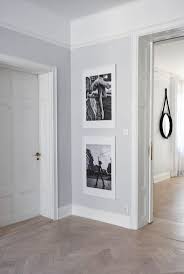 Go neutral and pair grey with white. Pale Grey Hallway With Parquet Flooring Contemporary Hallway Narrow Hallway Decorating Grey And White Hallway