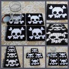 Cut out a 1/2x1/2 square of your printed paper and iron a test patch where it won't be noticeable. Free Printable Plastic Canvas Patterns Skulls Google Search Plastic Canvas Coasters Plastic Canvas Patterns Plastic Canvas Crafts
