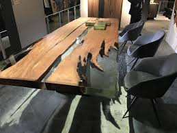 Their collaboration, which includes a bench and a coffee table, combines decorative layered resin art with a walnut slab of reclaimed wood. Resin Furniture Forever Encapsulates Beauty In Extraordinary Designs
