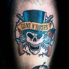 He painted it black, because he hated slash and the other guys in 2006. 40 Guns And Roses Tattoo Designs For Men Hard Rock Band Ink Ideas Rock And Roll Tattoo Rose Tattoos Rock Tattoo