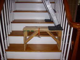 An adjustable ladder for stairs can be of big help for cleaning and painting the staircase, and also in designing ceilings above it. Setting Up A Ladder On Stairs Fine Homebuilding