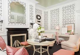 Vibrant pink living room designed with gallery frames and interlaced mirrors. Black Lacquered Fireplace Eclectic Living Room Tobi Fairley