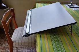 A drawing board (also drawing table, drafting table or architect's table) is, in its antique form, a kind of multipurpose desk which can be used for any kind of drawing, writing or impromptu sketching on a large sheet of paper or for reading a large format book or other oversized document or for drafting precise. Portable Mid Size Drawing Board For Art Or Drafting