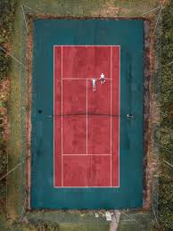 Feel free to download all of these desktop background pictures of nature for free. Wallpaper Id 259178 A Drone Looking Down At An Outdoor Tennis Court Fitness On The Tennis Court 4k Wallpaper