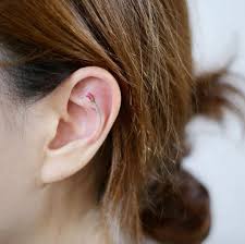 Tiny Rose Ear Tattoo By Doy Tiny Rose Tattoos Small Tattoos Cool Small Tattoos