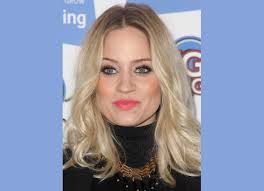 Pregnant Kimberly Wyatt with her hair curled away from her face