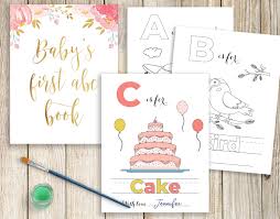 If you want a baby shower that people will be talking about weeks later, there are 7 aspects of baby shower planning you need to consider. Baby S First Alphabet Book Baby Shower Abc Book Etsy Baby Shower Activities Storybook Baby Shower Baby Shower Book