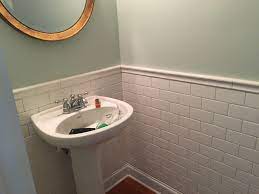 Below that, a band of accent tile of some sort. Subway Tile Half Bath With Ceramic Chair Rail Diy Chairrail White Leather Dining Chairs Top Bathroom Design Round Back Dining Chairs