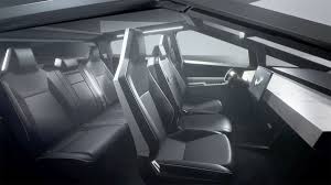 The infotainment display and the steering wheel. Closer Look Cybertruck Interior As Seen In The Test Ride Videos