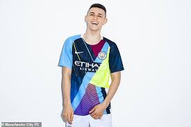 Erling haaland celebrates scoring for borussia dortmund vs schalke. Manchester City Release Bizarre New Mash Up Kit Featuring Nine Old Shirts Daily Mail Online