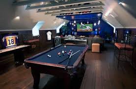 A classy game room with a billiards pool and a bar under the ceiling with beams lighted by beautiful pendant lights and wall lighting. 60 Game Room Ideas For Men Cool Home Entertainment Designs