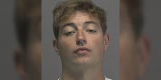 Suspect charged in S. Kerr Ave. hit-and-run that injured motorcyclist