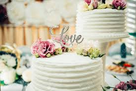 Feast your eyes on these stunning purple cake designs. Inscription Love On White Wedding Cake With Purple Flowers Stock Photo Picture And Royalty Free Image Image 147056452