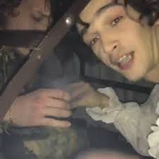 The 1975 stars Matt Healy and George Daniel caught smoking a cigarette  under their table inside the BRIT Awards 2017 ceremony