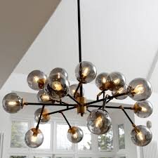 Black And Brass Glass Pendant Light A Real Statement Light With Its Combination Of Metallic Smoky Glass Shades Black Metal And Brass Finish Fittin Glass Pendant Light Pendant Light Glass Shades