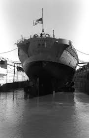 A stern view of the battleship USS MISSOURI (BB-63) in dry dock at Long  Beach Naval Shipyard as the vessel undergoes routine overhaul. The  five-bladed inboard and four-bladed outboard propellers convert 212,000