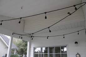 Drill holes in the board to hide the ends of the string. The Easiest Way To Hang String Lights On A Screened Porch