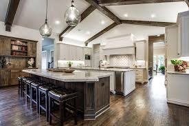 The large ceiling beams add a roughness to the design. 27 Amazing Double Island Kitchens Design Ideas Designing Idea