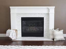 The fireplace now consisted of a painted wooden mantle and trim, with a brick façade around the firebox. How To Tile A Fireplace This Old House