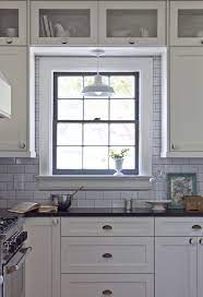 Black And White Cottage Kitchen With White Shaker Cabinets Accented With Brass Cup Pulls And White Ceramic Kitchen Renovation Eclectic Kitchen Kitchen Remodel