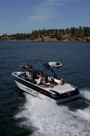 2012 malibu boats 23 lsv l96 6.0l 410hp engine 415 hours high altitude prop water cooled shaft seal silent tip exhaust power wedge malibu launch system stainless led docking lights rear walk over 2 batteries towable boat cover 2 channel rockford 400w amp 4 wet sound tower speakers 4 led tower lights zero off gps stereo remote usb charger trailer i. New 2012 Malibu Boats Ca 23 V Ride Ski And Wakeboard Boat Black And White Driving Away Malibu Boats Boat Wakeboard Boats