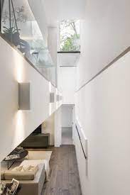 A Double Height Lightwell Brings Southern Light Down Into The Basement Of The St John S Wood Road Property An Basement Remodel Diy Basement Light Atrium Design